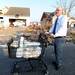Busch's grocery store manager Gary Winters pushes a cart with water in it around Huron Farms neighborhood March 16, 2012, after a tornado hit Dexter.  Angela J. Cesere | AnnArbor.com
